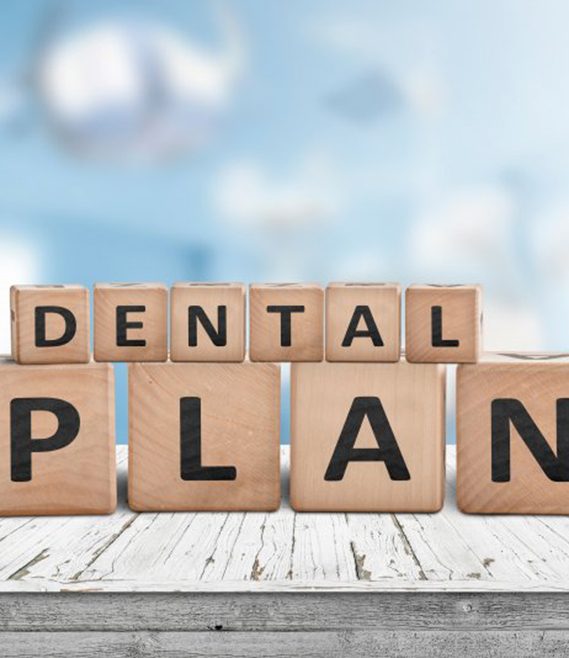 wooden blocks stacked together and spelling out dental plan