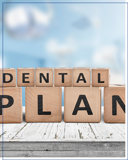 wooden blocks stacked together and spelling out dental plan