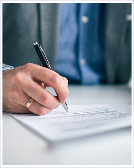 Woman sitting in a cozy chair and holding a piggy bank