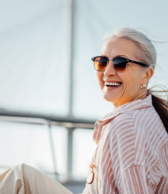 Happy, smiling senior woman enjoying time outdoors