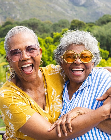 Older women smiling after receiving dermal fillers in Jacksonville