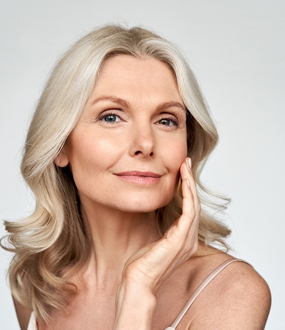 Woman pleased with her appearance after receiving dermal fillers
