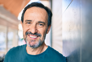 Smiling older man and woman in their home