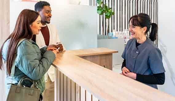 patients talking to a dental insurance coordinator